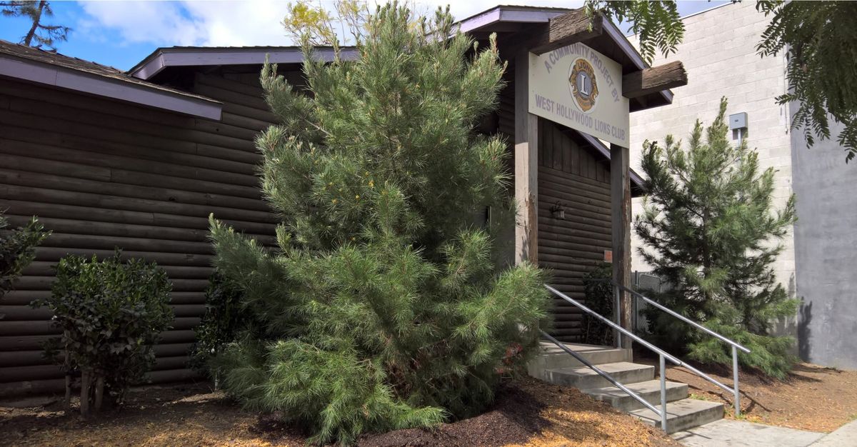 The Log Cabin on Robertson Boulevard, with its sign reading “A Community Project by West Hollywood Lions Club”